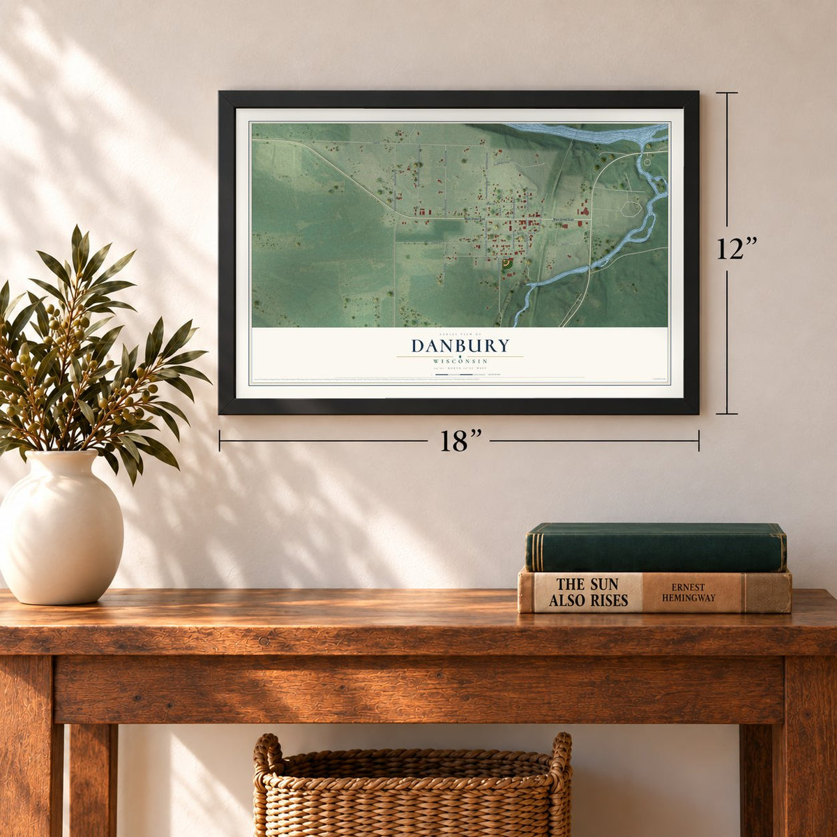 Danbury, Wisconsin map, 12 x 18 inch print in a black frame in an entryway