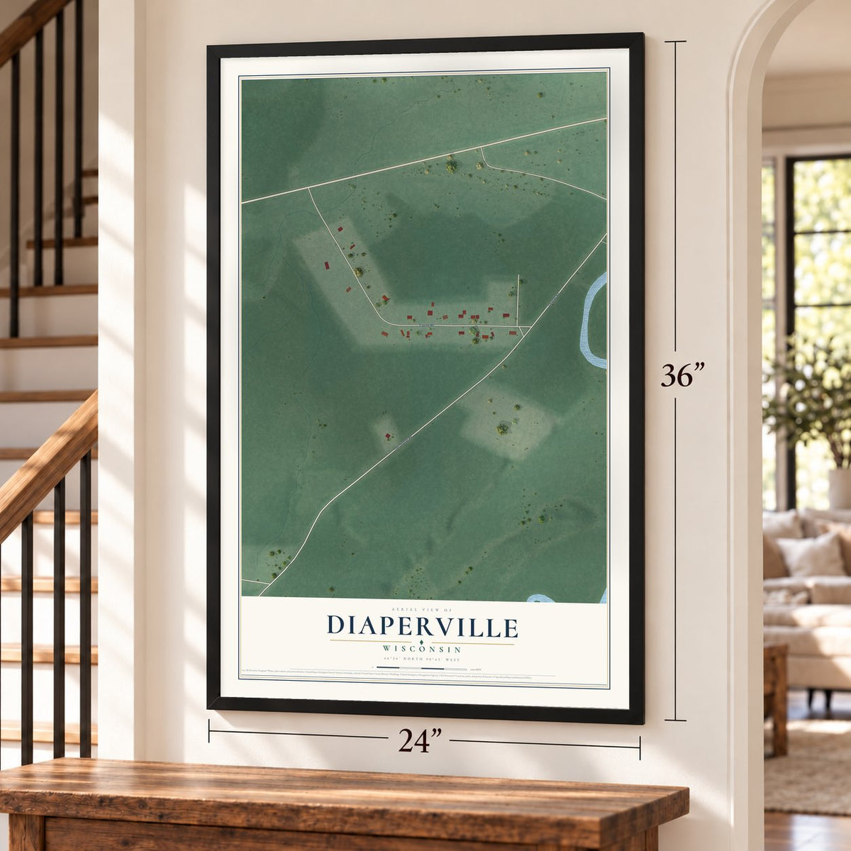 Diaperville, Wisconsin map, 24 x 36 inch print in a black frame by a staircase