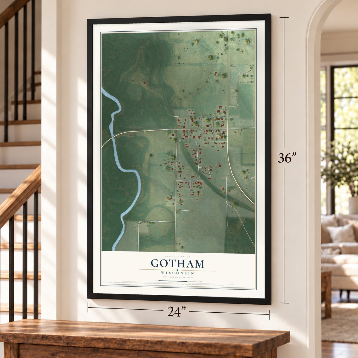 Gotham, Wisconsin map, 24 x 36 inch print in a black frame by a staircase