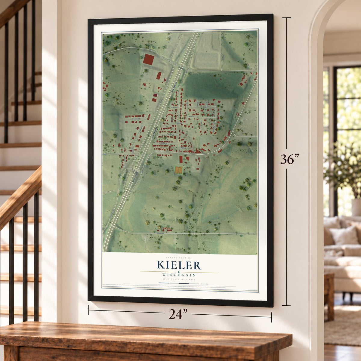 Kieler, Wisconsin map, 24 x 36 inch print in a black frame by a staircase