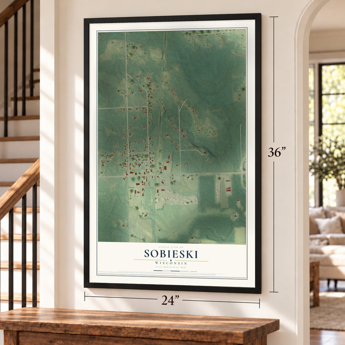 Sobieski, Wisconsin map, 24 x 36 inch print in a black frame by a staircase