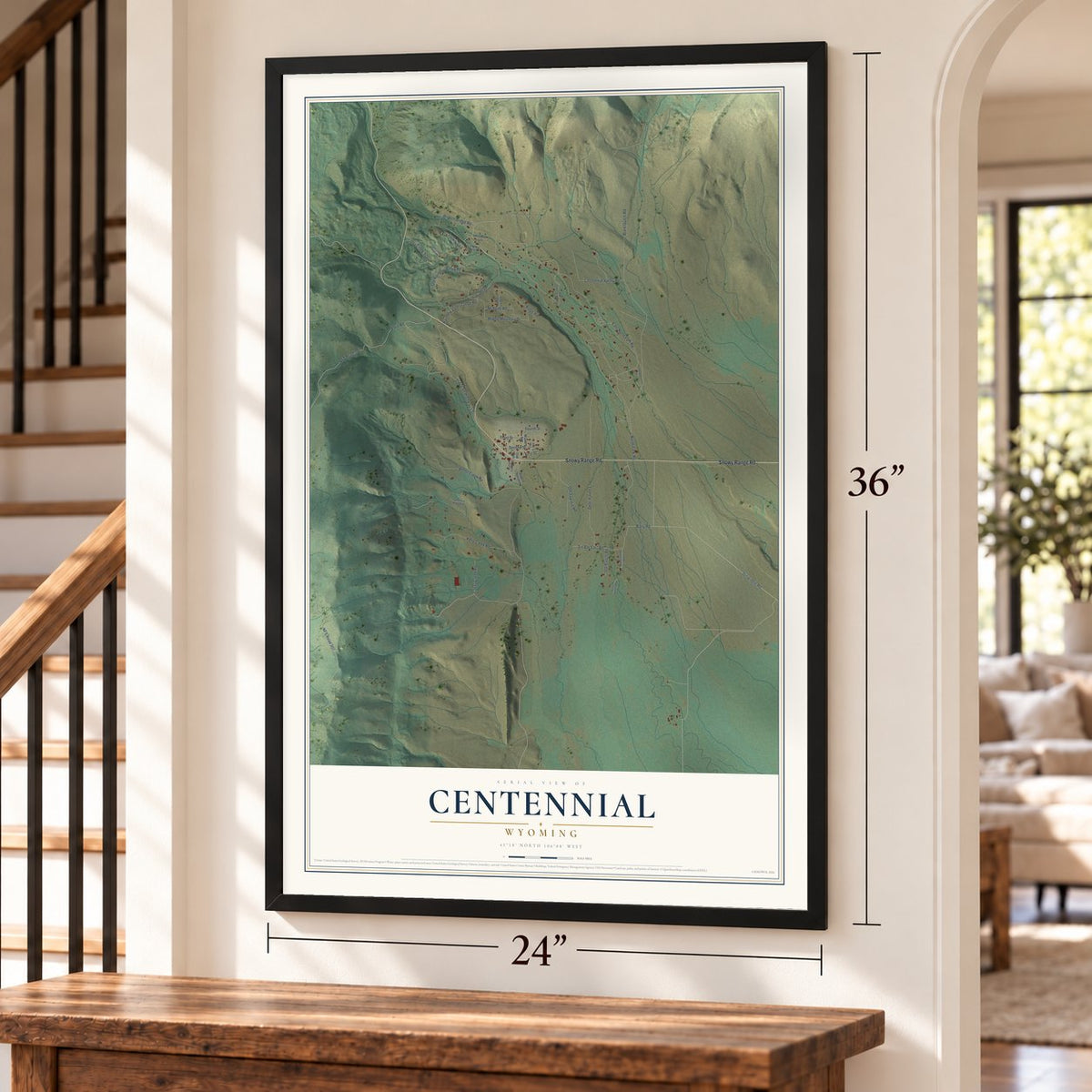 Centennial, Wyoming map, 24 x 36 inch print in a black frame by a staircase