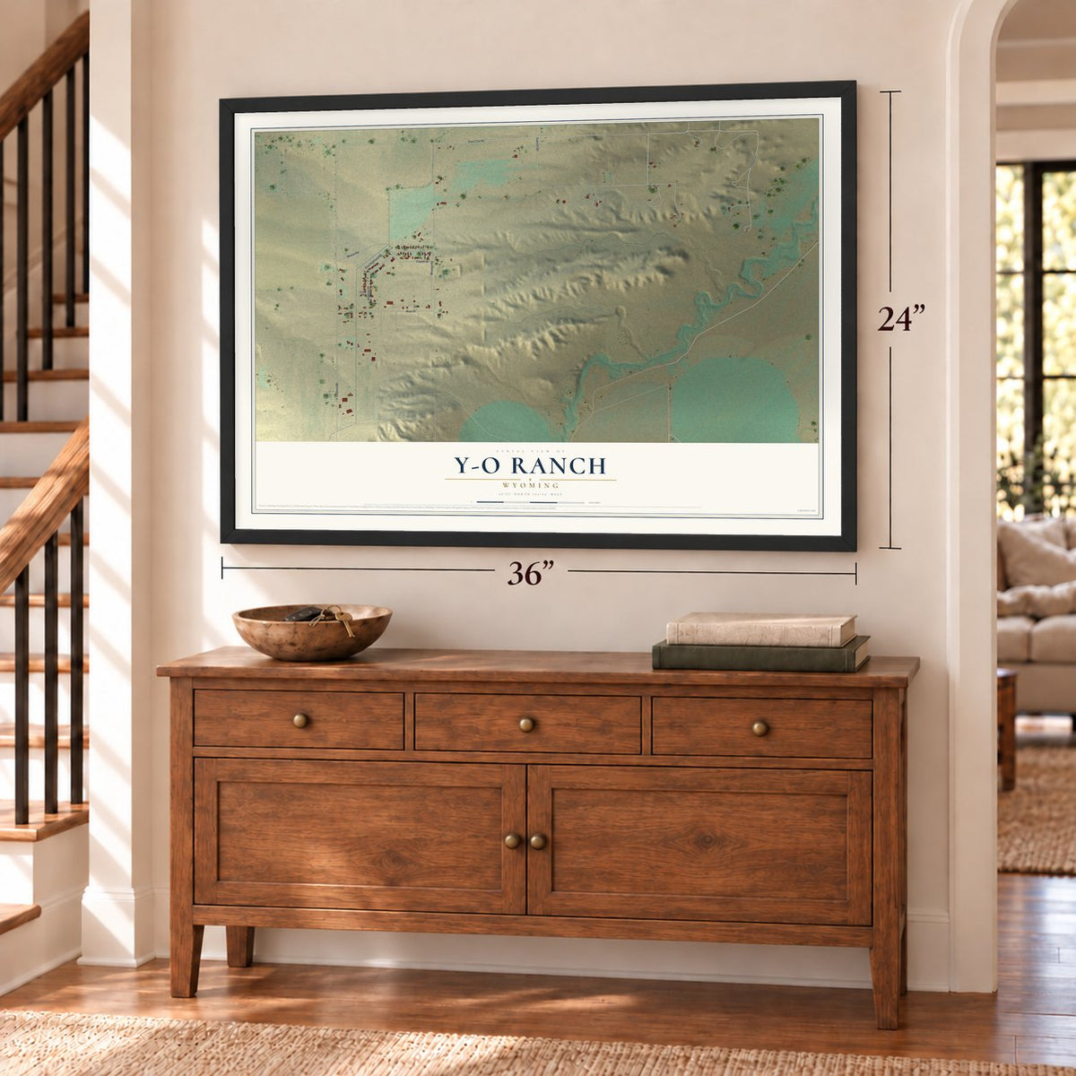 Y-O Ranch, Wyoming map, 24 x 36 inch print in a black frame above a dresser by a staircase
