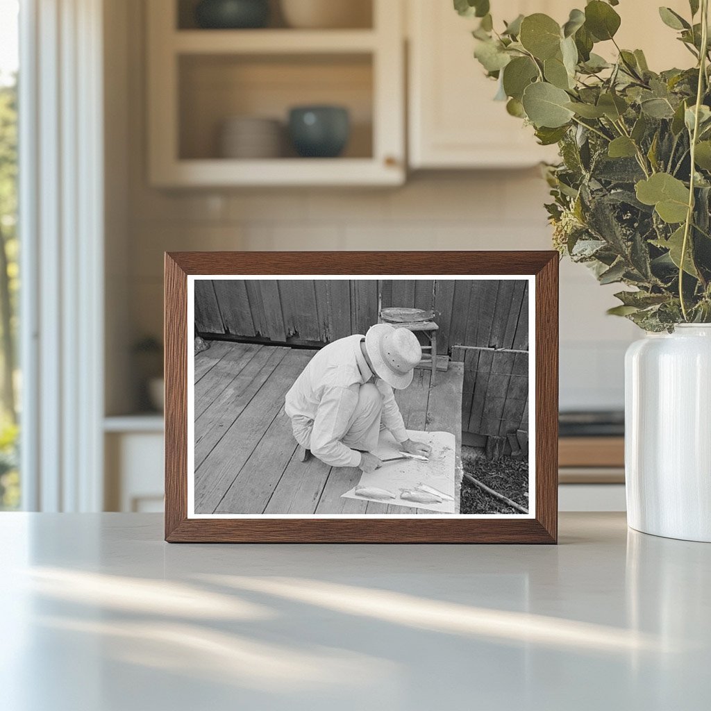 Man Cleaning Fish on Waterfront Olga Louisiana September 1938 - Available at KNOWOL