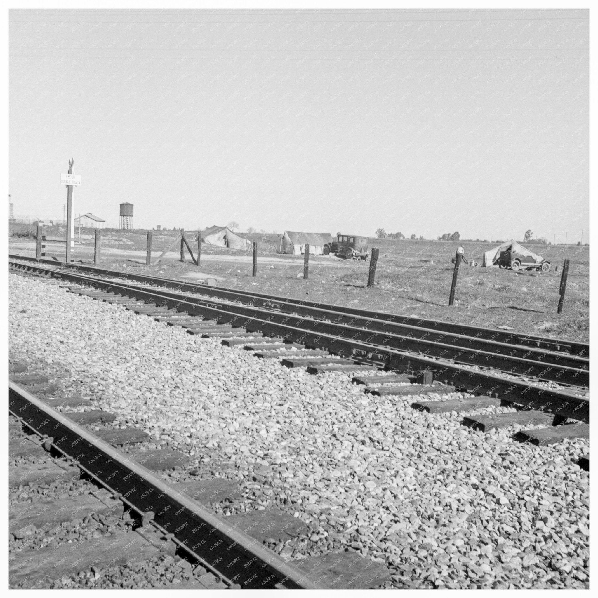 Migrant Tents by Southern Pacific Railroad Fresno 1939 - Available at KNOWOL