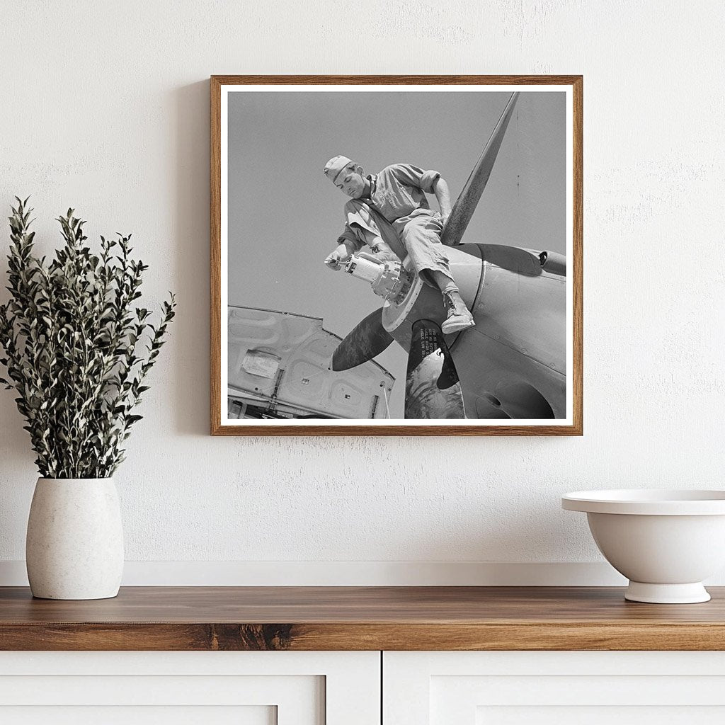 Repairman on Airplane Propeller Hub Lake Muroc 1942 - Available at KNOWOL