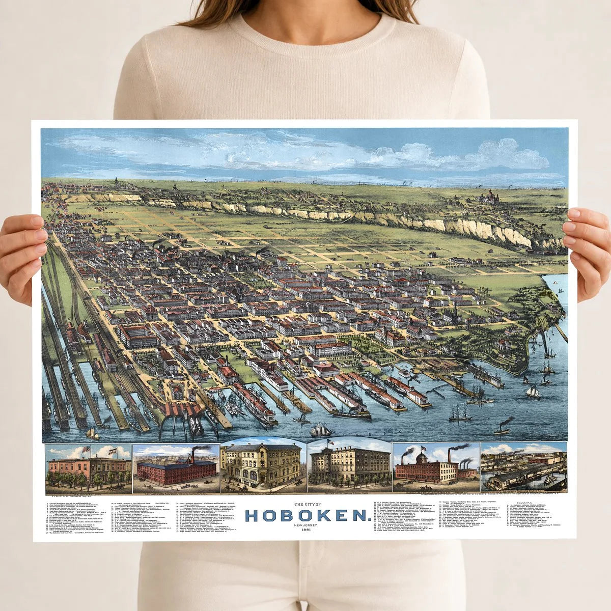 Restored and colorized 1881 bird’s-eye view map of Hoboken, New Jersey, showing historic streets, Hudson River waterfront, railroads, piers, steamers, churches, factories, homes, and landmarks.