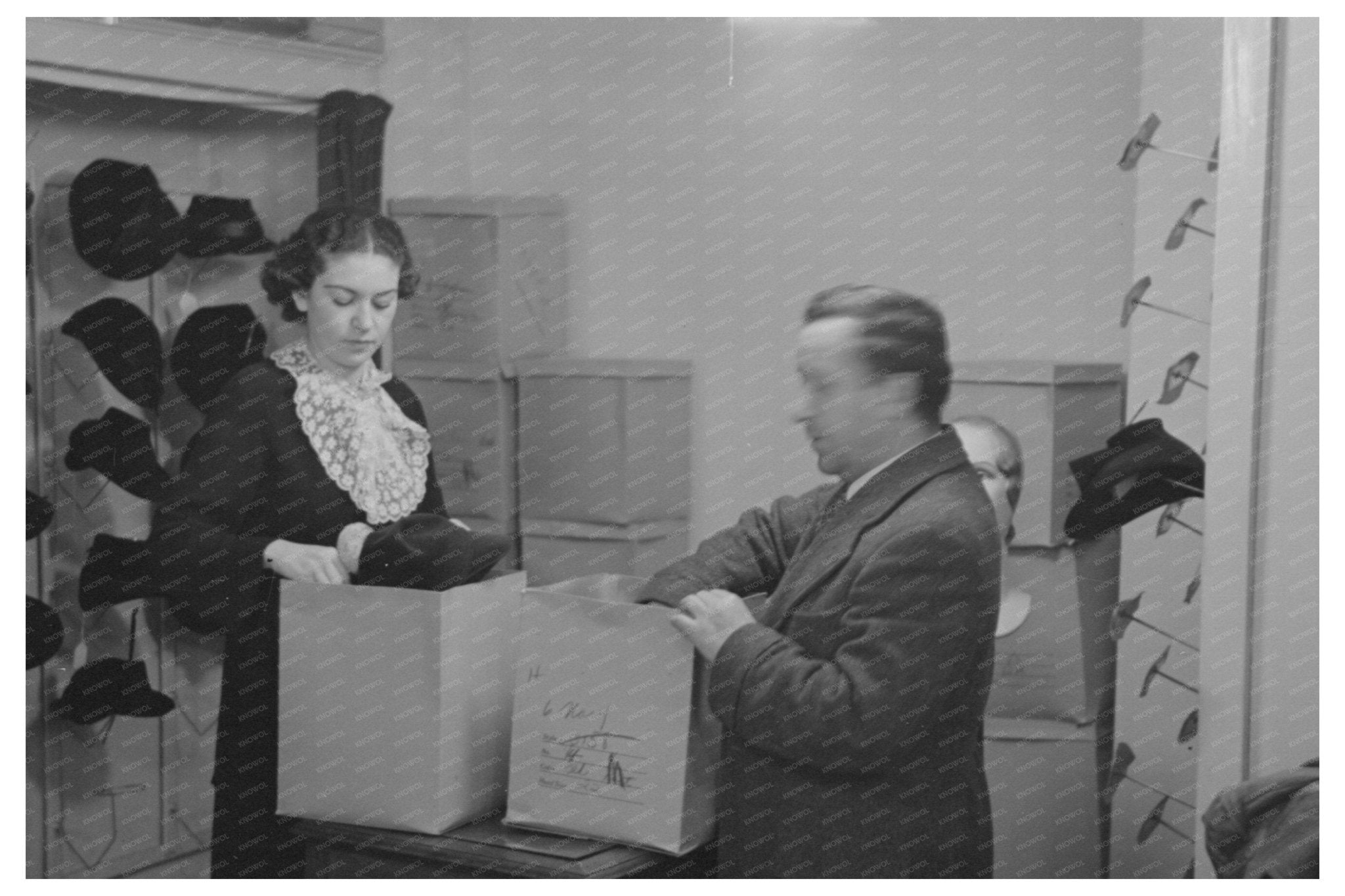 1936 Vintage Photo of Model Trying Hat in NYC Showroom - Available at KNOWOL