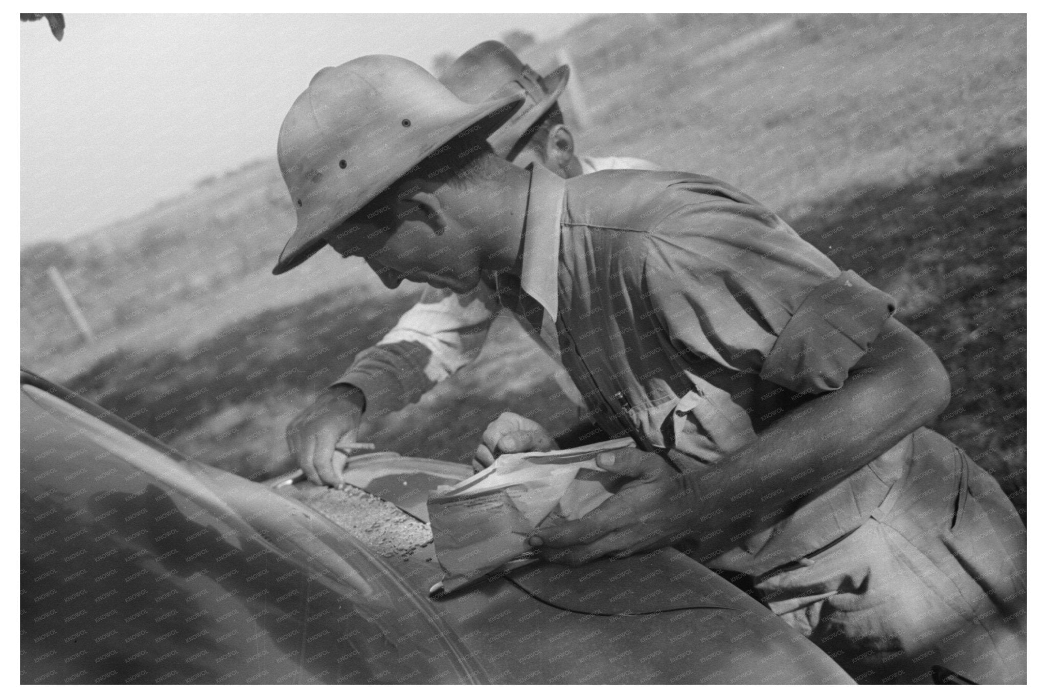 1938 Man Examining Rice Quality in Louisiana - Available at KNOWOL