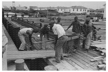 1938 Stevedores Loading Stove at Burwood Louisiana Waterfront - Available at KNOWOL