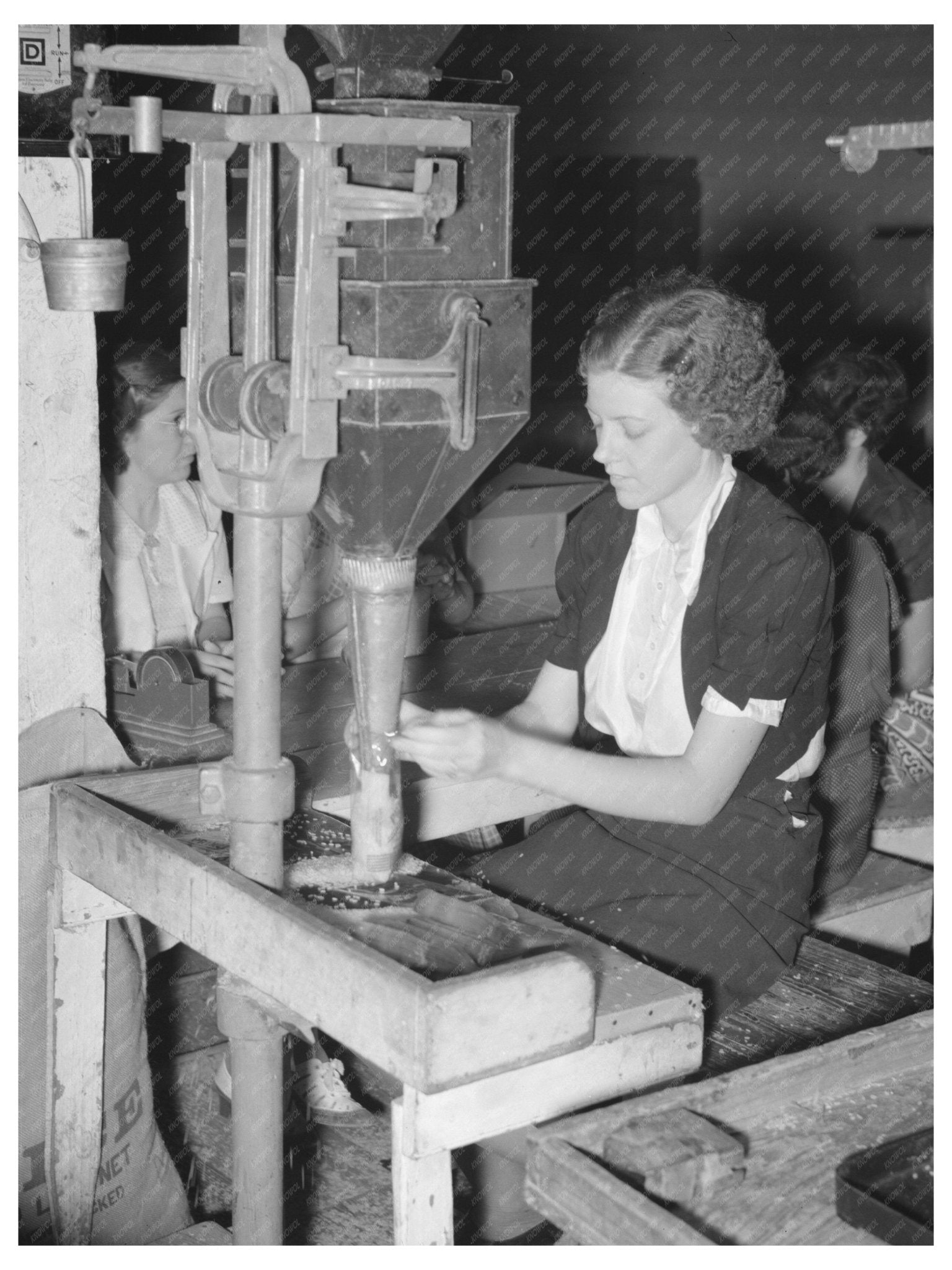 1938 Workers Filling Cellophane Sacks in Louisiana Rice Mill - Available at KNOWOL