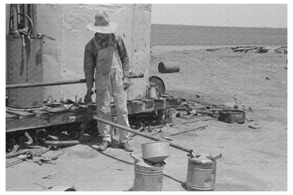 1939 Day Laborer Filling Gas Cans on Texas Farm - Available at KNOWOL