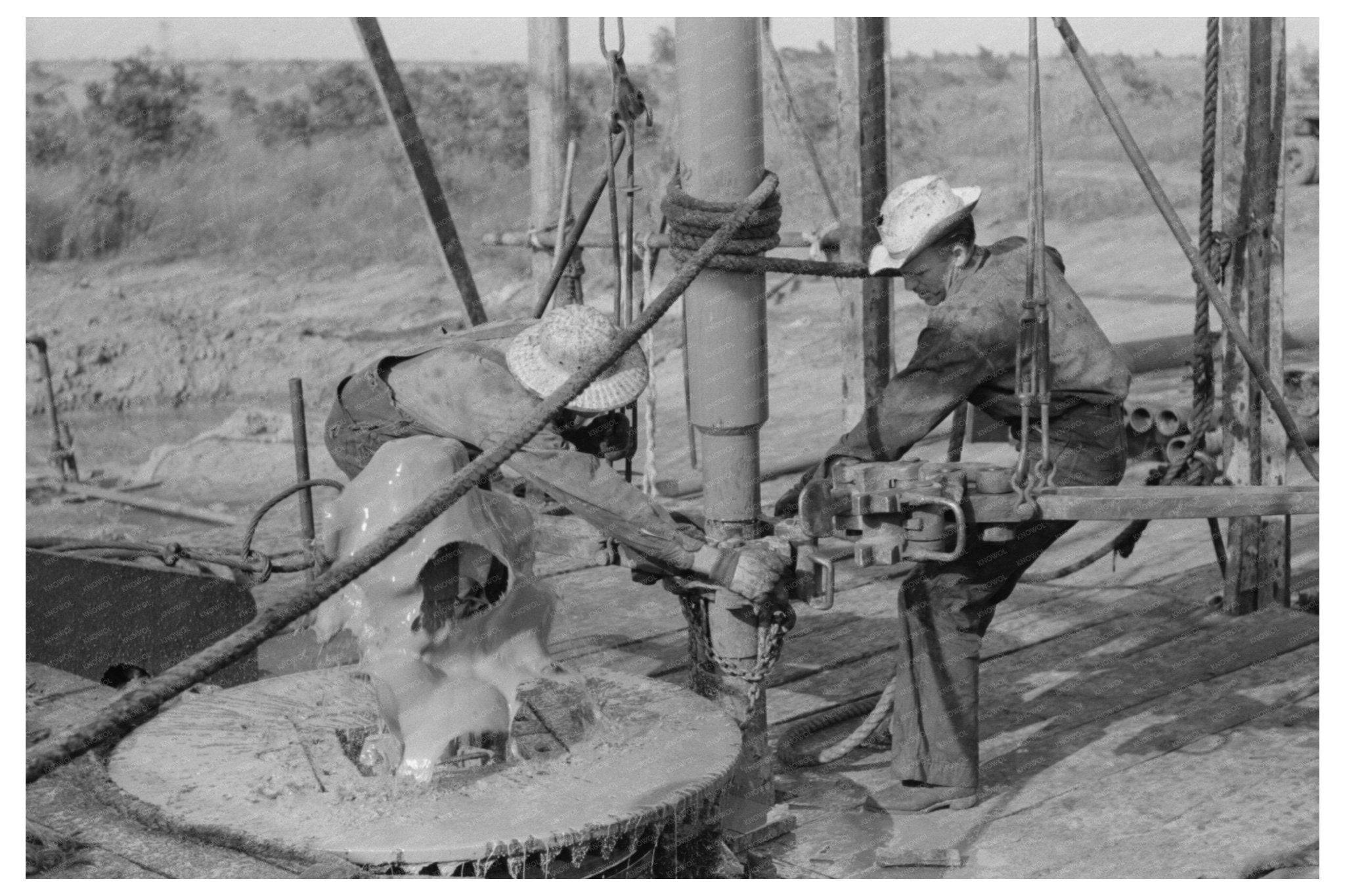 1939 Workers Installing Drilling Pipe at Oklahoma Oil Well - Available at KNOWOL