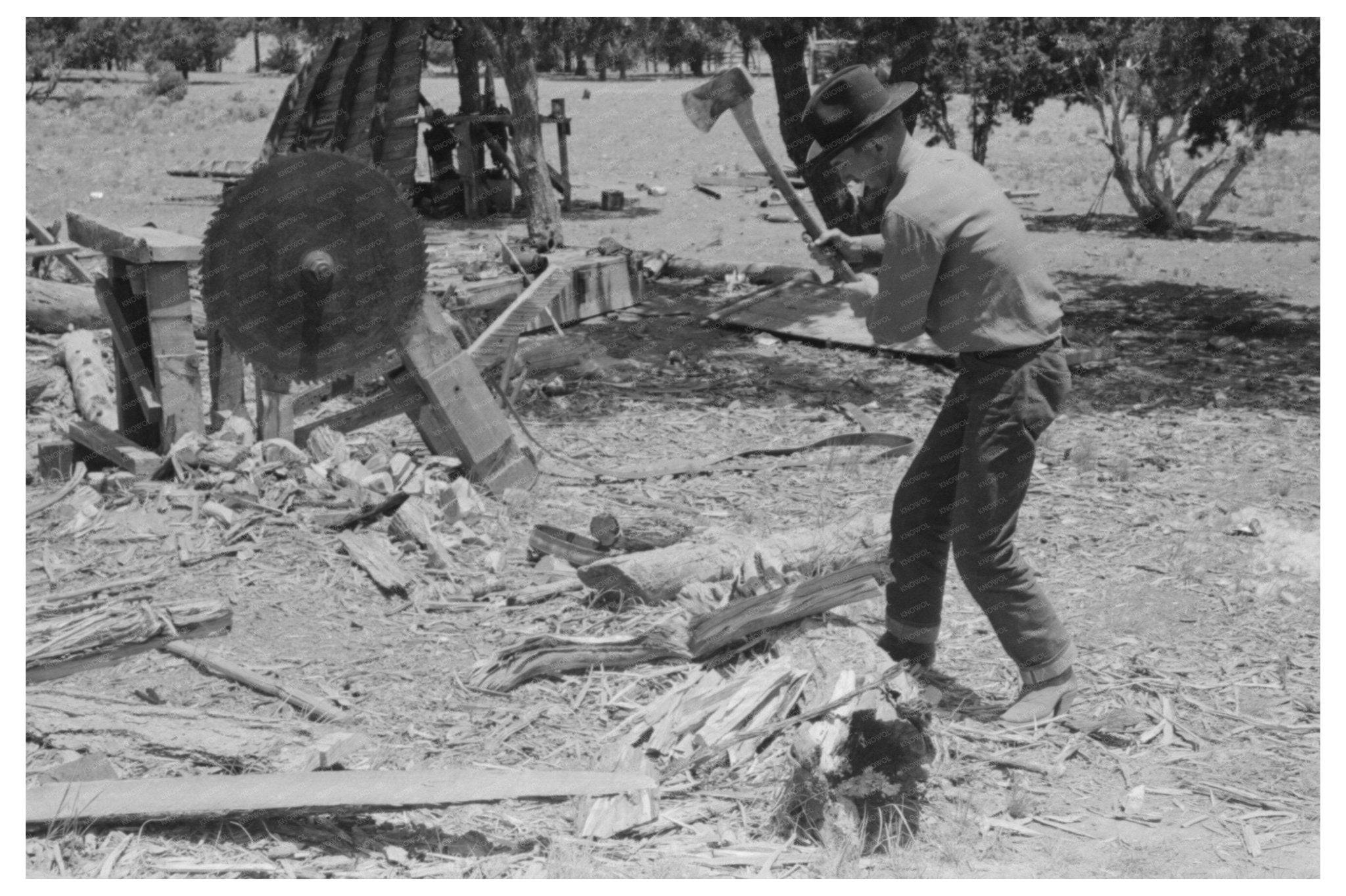 1940 Farmer Chopping Wood in Pie Town New Mexico - Available at KNOWOL