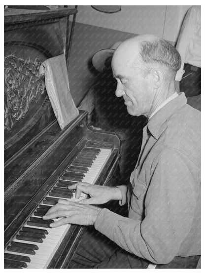 1940 Migratory Laborer Playing Piano in Arizona Camp - Available at KNOWOL