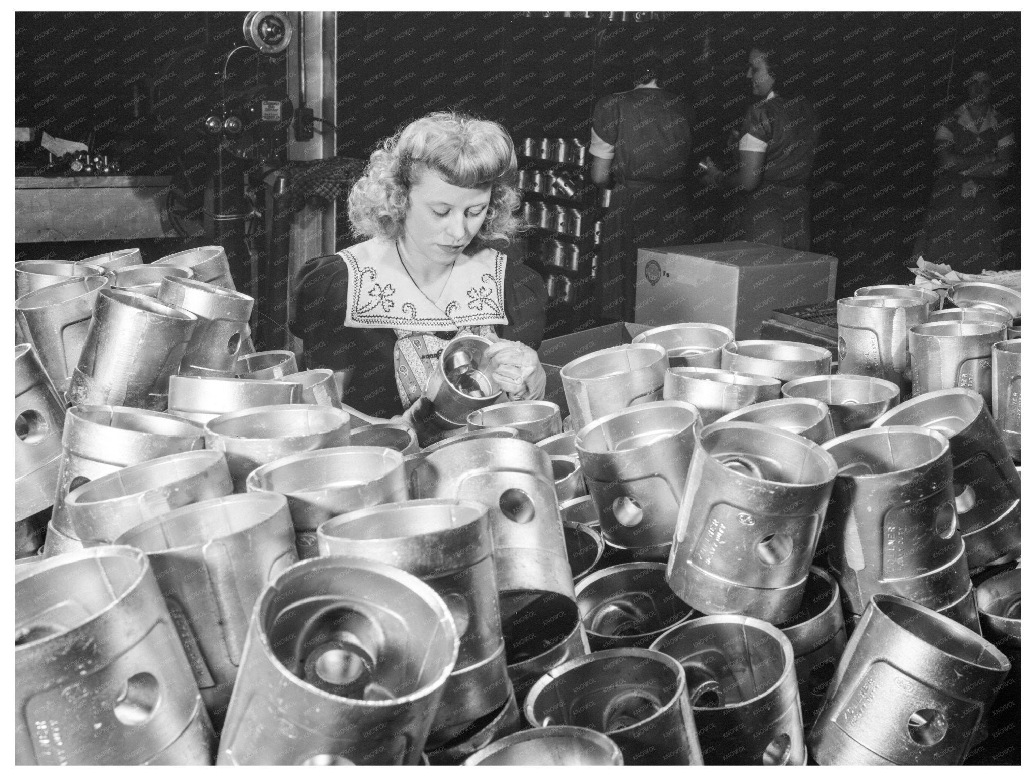 1942 Woman Inspecting Aluminum Pistons at Cincinnati Factory - Available at KNOWOL