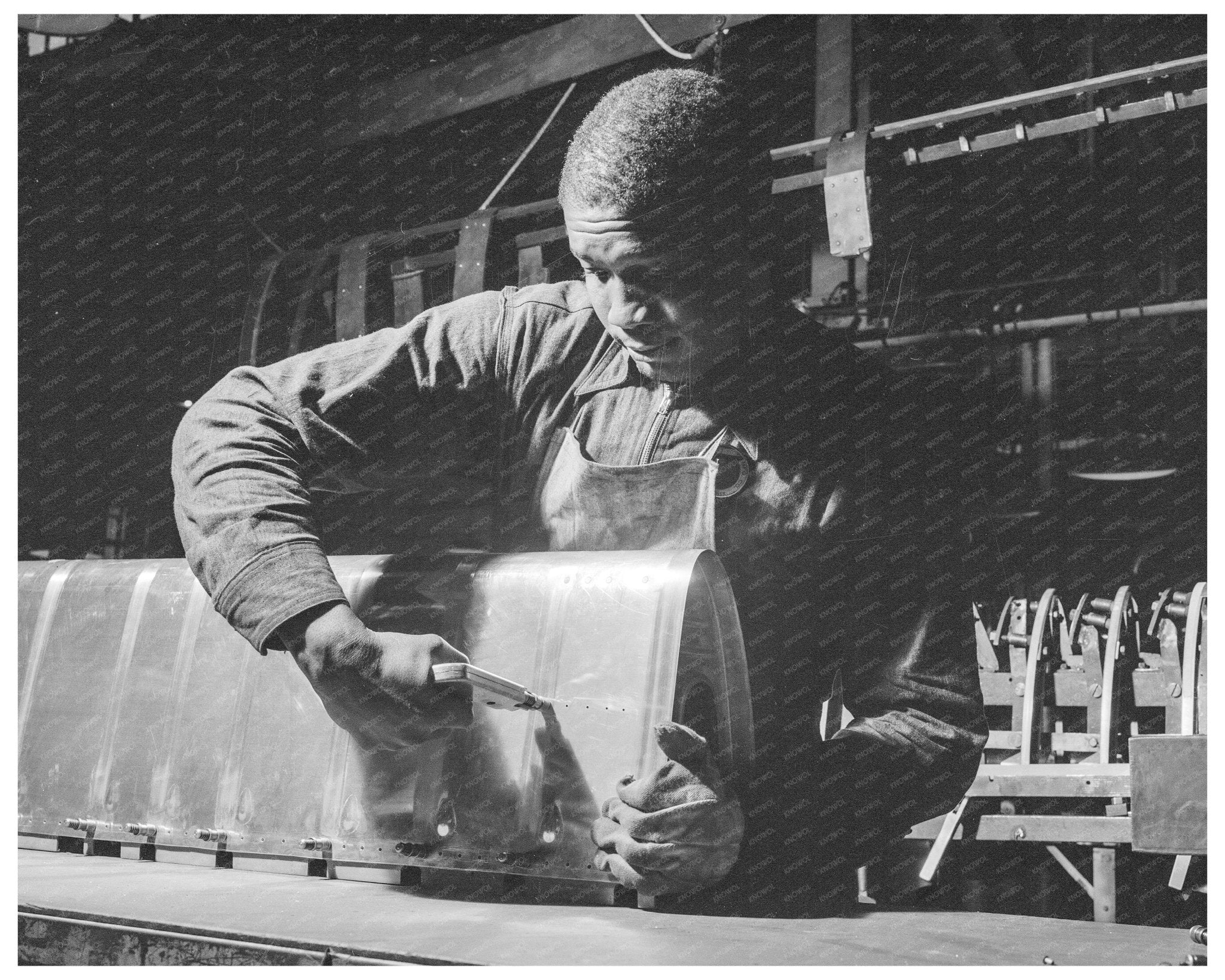 1942 Worker Assembling Airplane Wing at Briggs Manufacturing - Available at KNOWOL