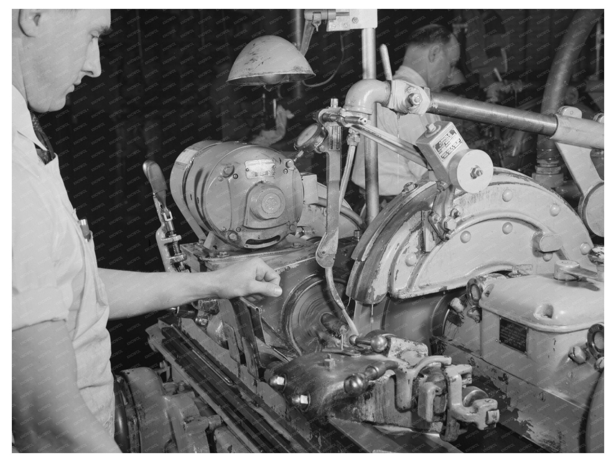 1942 Worker Operating Norton Grinder at Schick Inc. - Available at KNOWOL