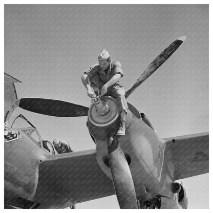 1942 Worker Servicing Interceptor Plane at Lake Muroc - Available at KNOWOL