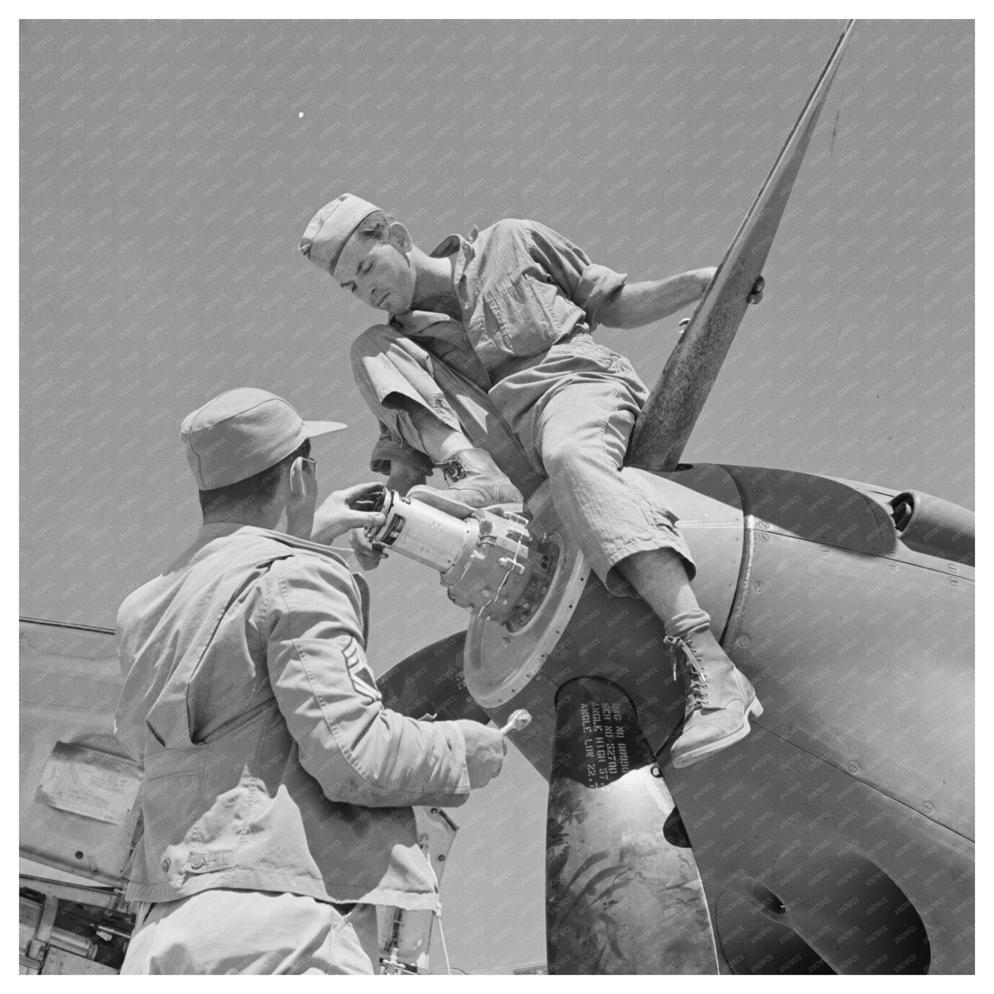 1942 Workers Repair Interceptor Plane at Lake Muroc - Available at KNOWOL