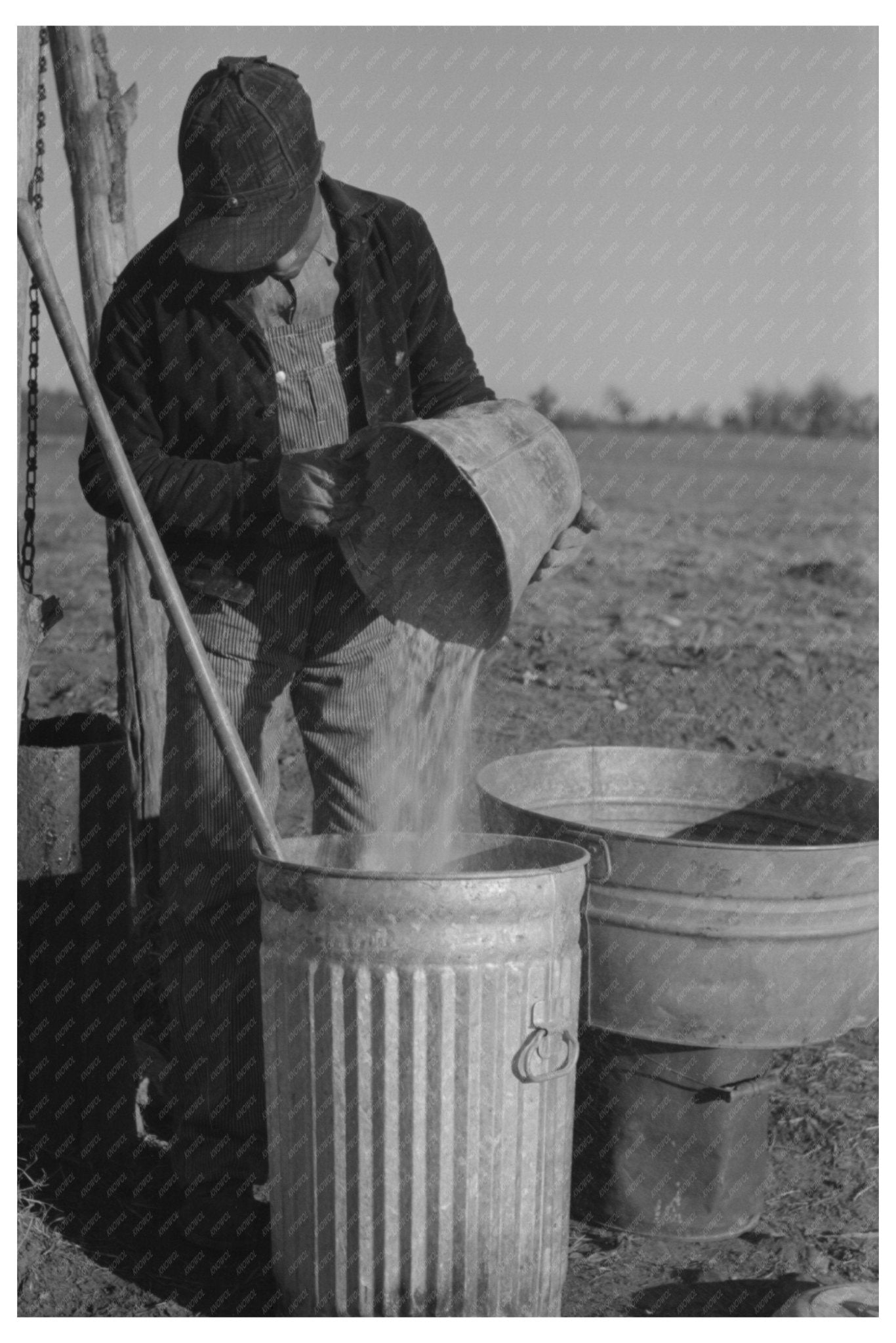 1944 Tenant Farmer Mixing Hog Feed in Oklahoma - Available at KNOWOL