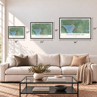 Village of Tupper Lake, New York map in 12 x 18, 18 x 24 and 24 x 36 inch sizes above a sofa