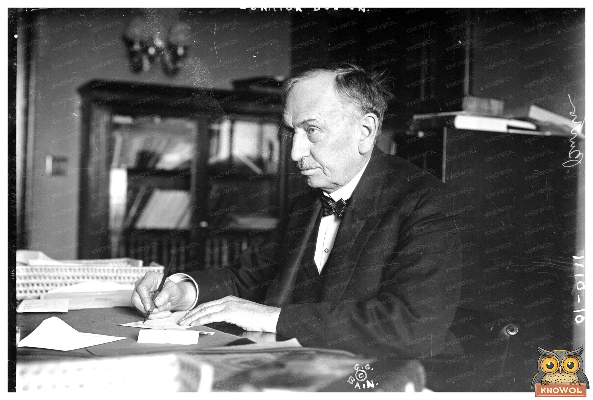 Senator Burton Captured Writing in Historic Moment