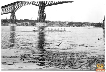1913 Collegiate Rowing Team in Dynamic Action