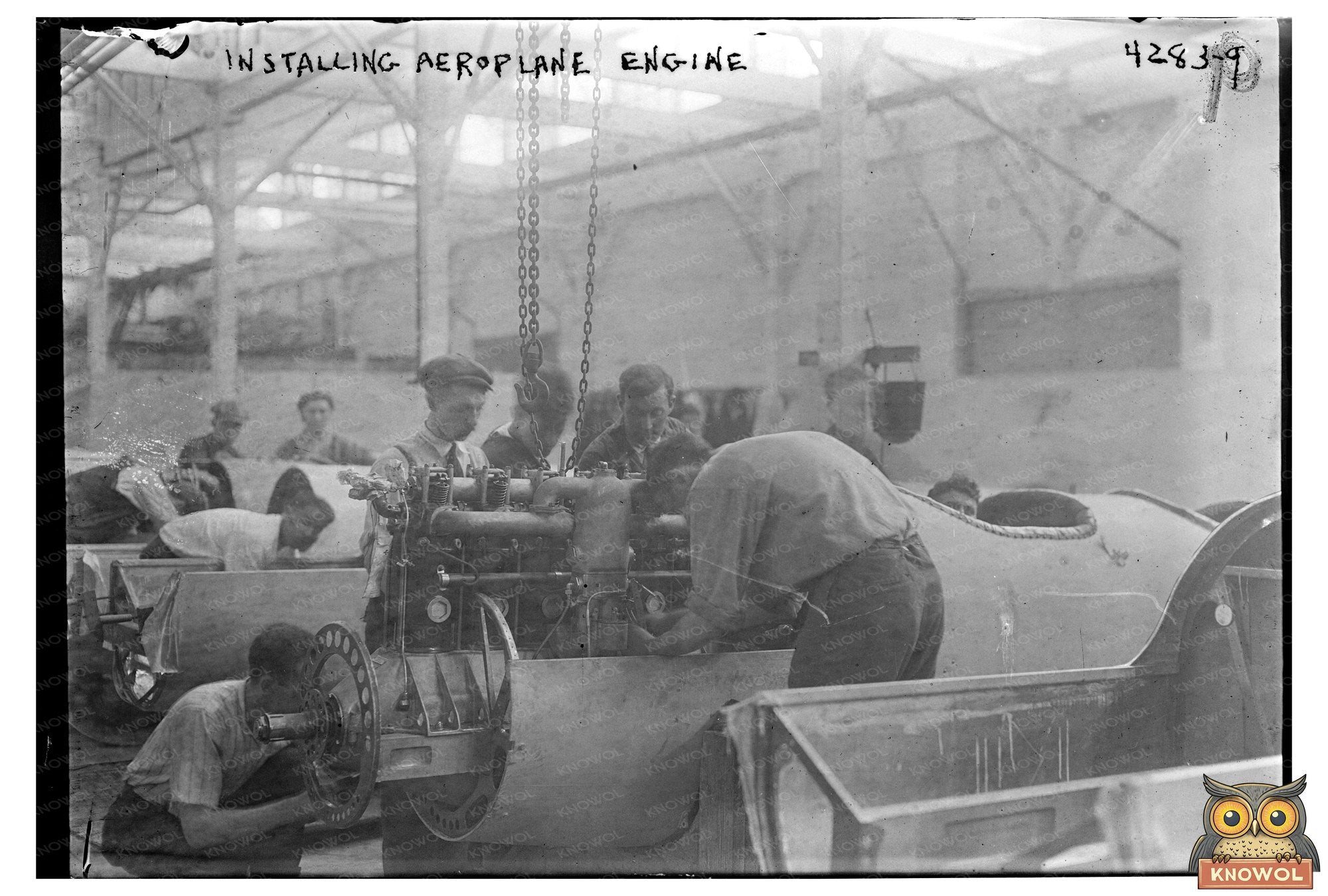 Mechanics at Work on Early Airplane Engine, 1915-1920