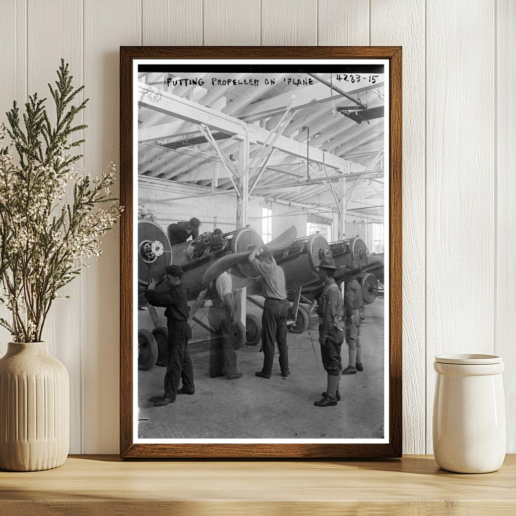1917 Moment: Worker Fitting Propeller on Vintage Plane