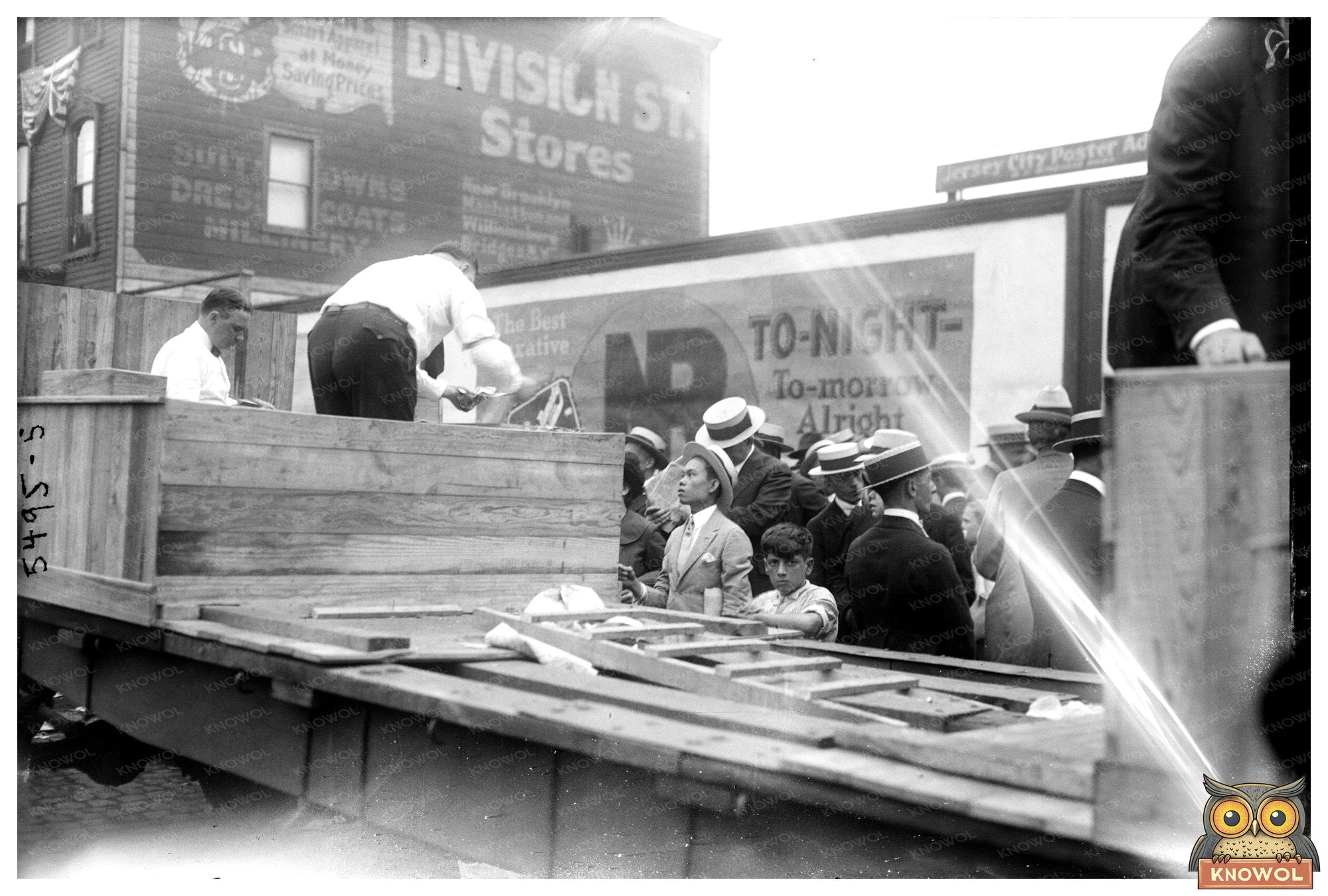 1920s Workers Unloading Freight: A Daily Scene