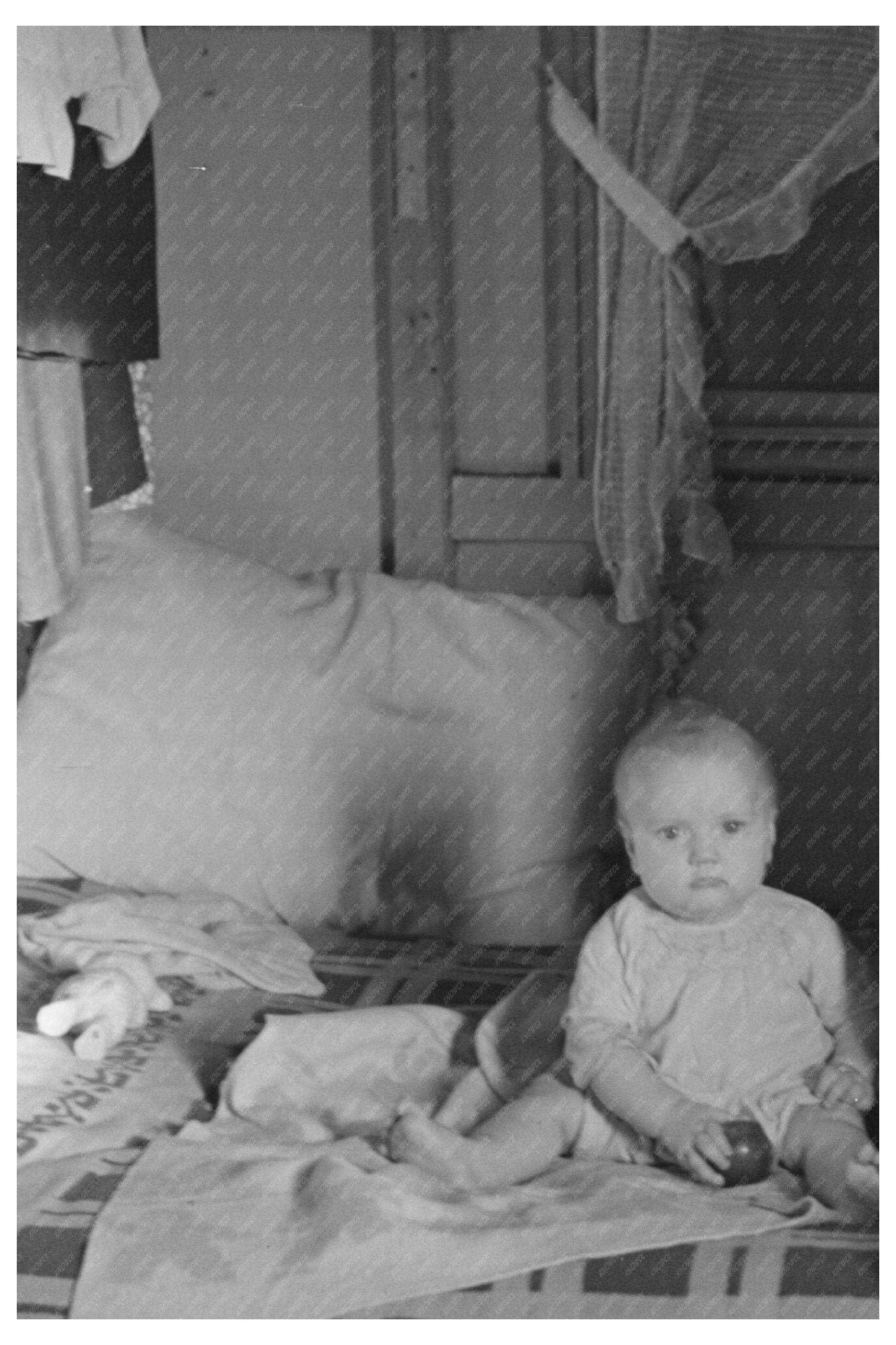 Mrs. Charles Benning and Baby in Shantytown Iowa 1936