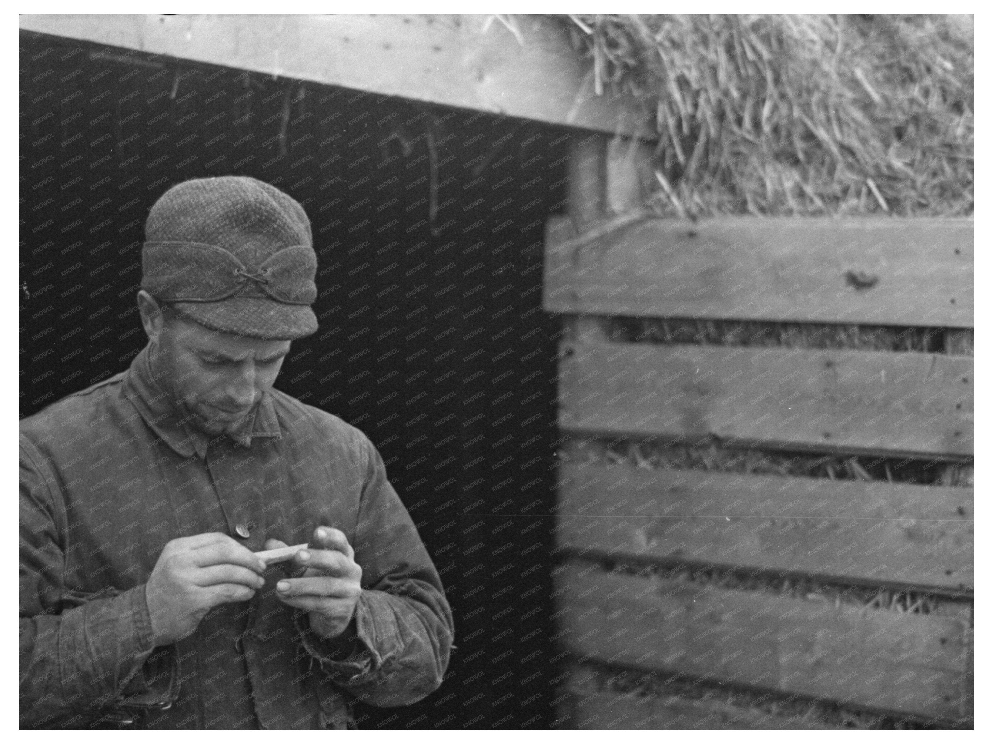 Farmer Rolling Cigarette in Estherville Iowa 1936