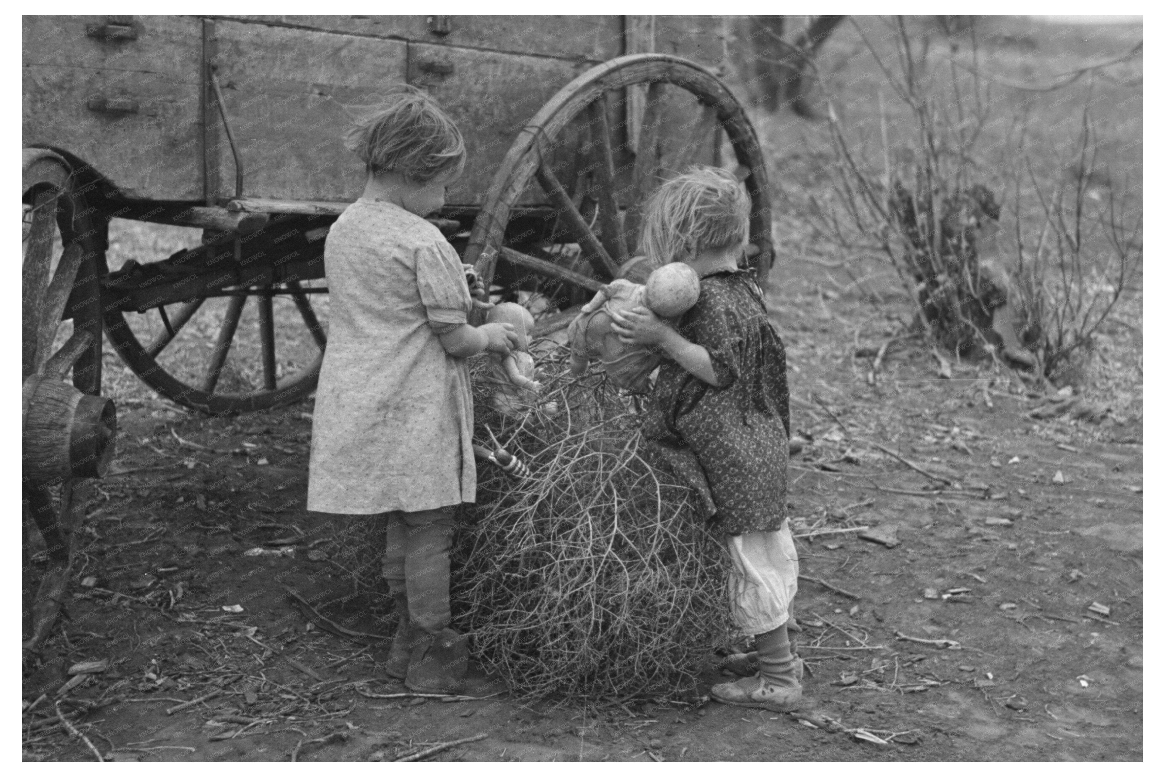 Children with Dolls in Tumbleweeds Smithland Iowa 1936