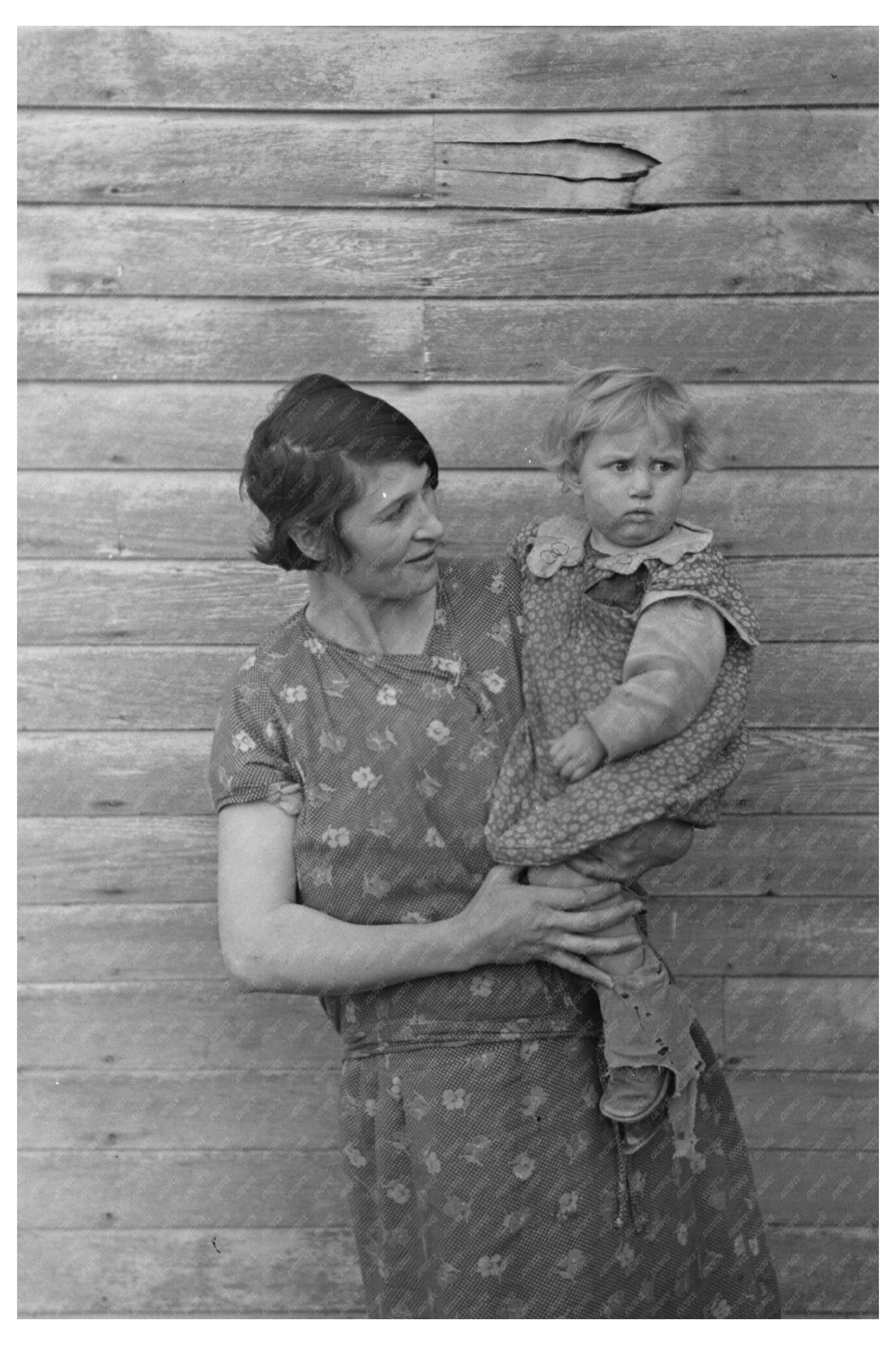 Mrs. Ed Boltinger and Child on Iowa Farm January 1937