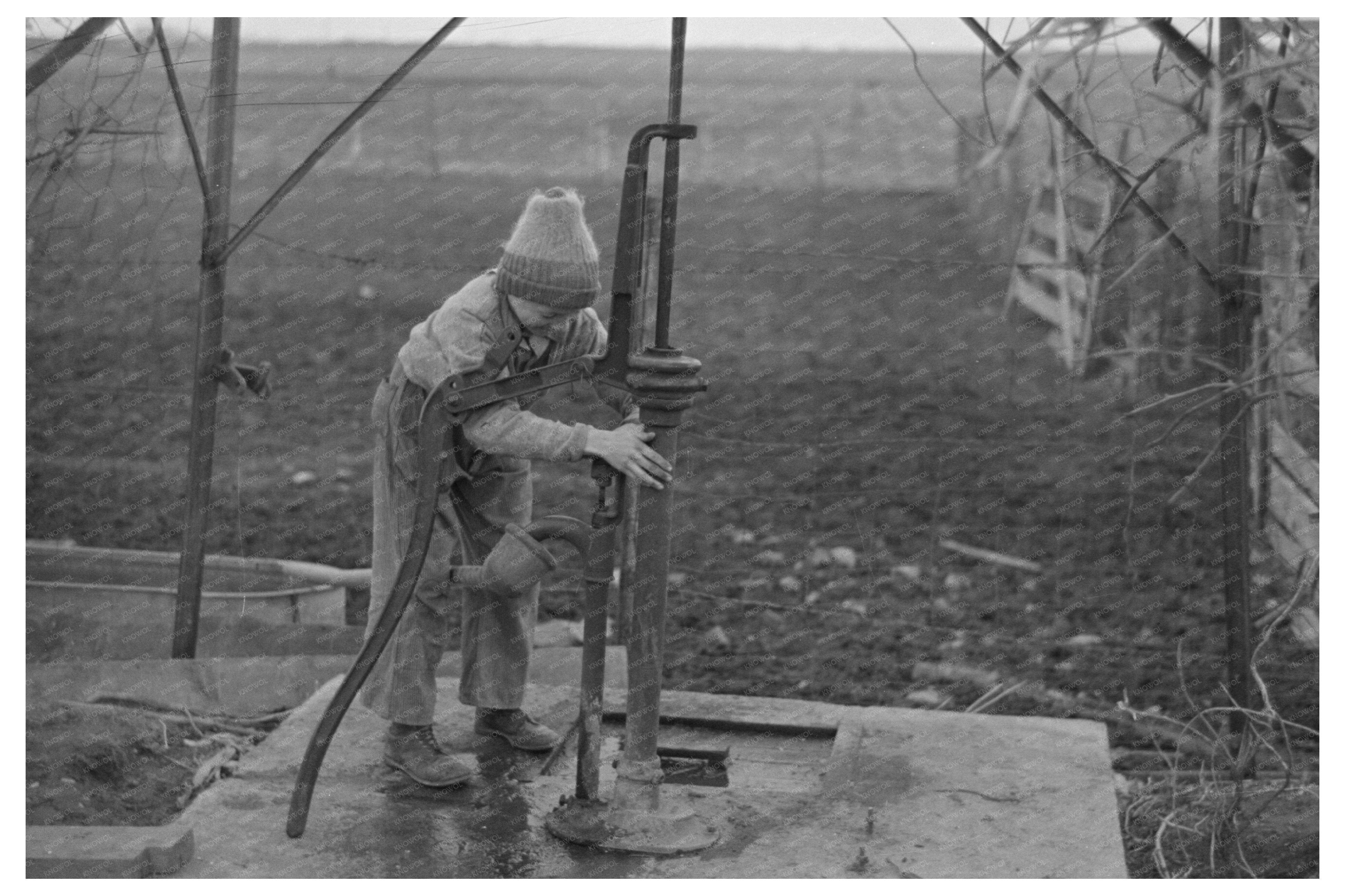 Tip Estes Son Disconnecting Windmill Pipe March 1937