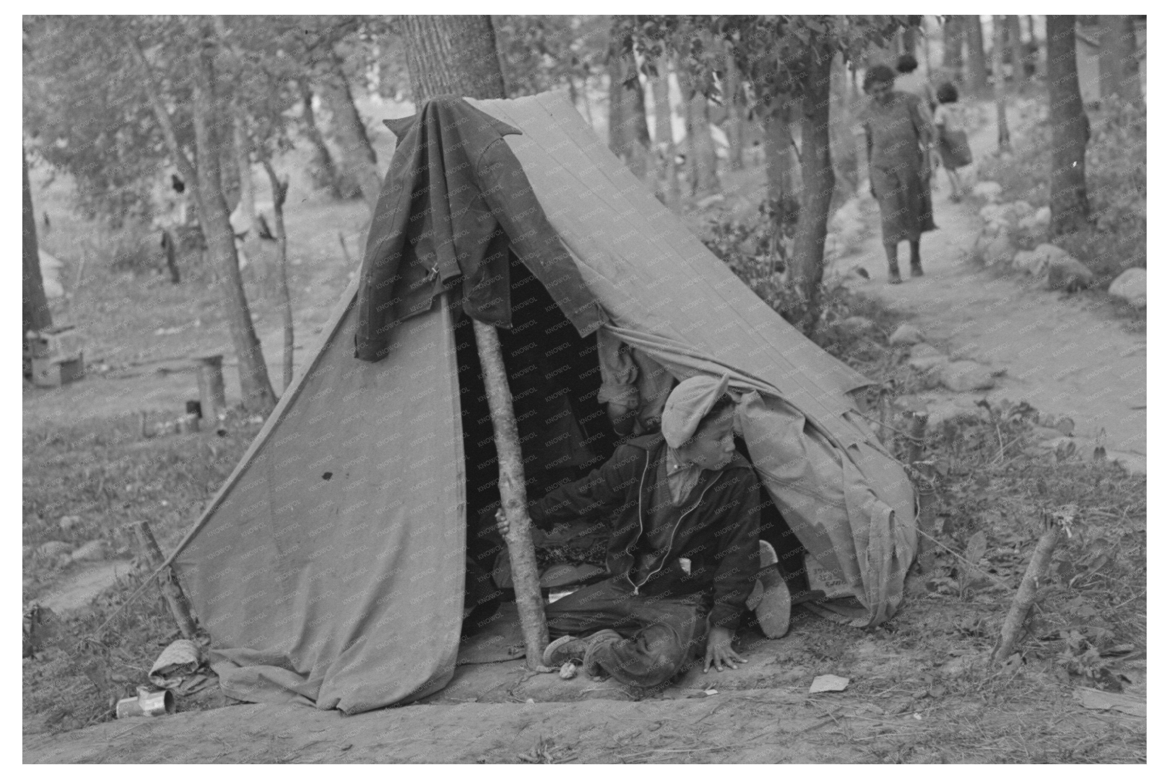 Indigenous Boy by Tent Little Fork Minnesota 1937