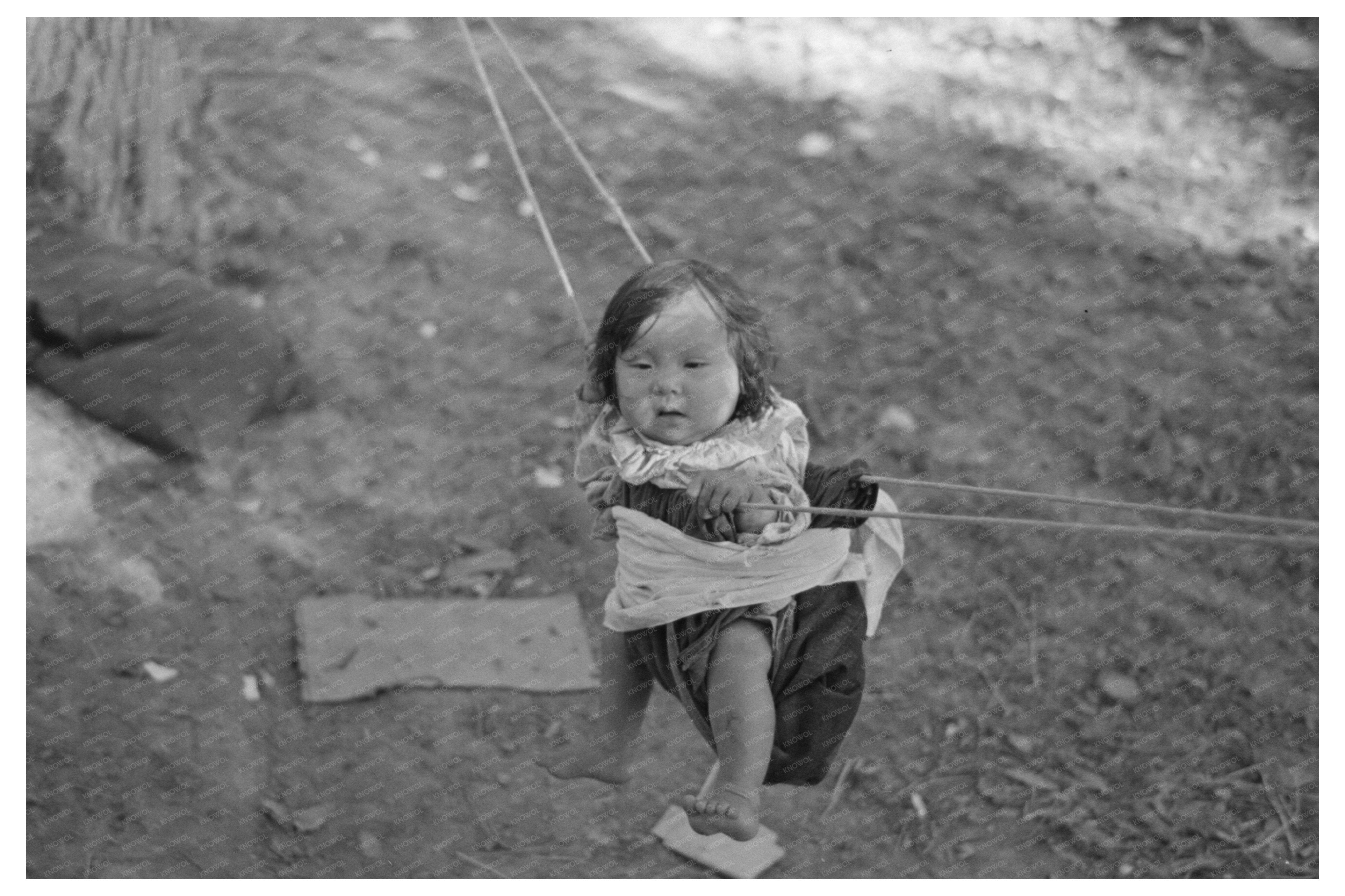 Indian Papoose in Swing Little Fork Minnesota 1937