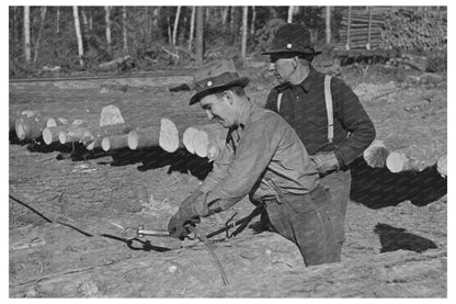 Lumberjack Adjusting Chain at Effie Minnesota 1937