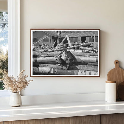 Lumberjack Resting on Logs Effie Minnesota 1937