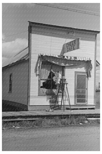 Girl Washing Café Windows in Cook Minnesota 1937