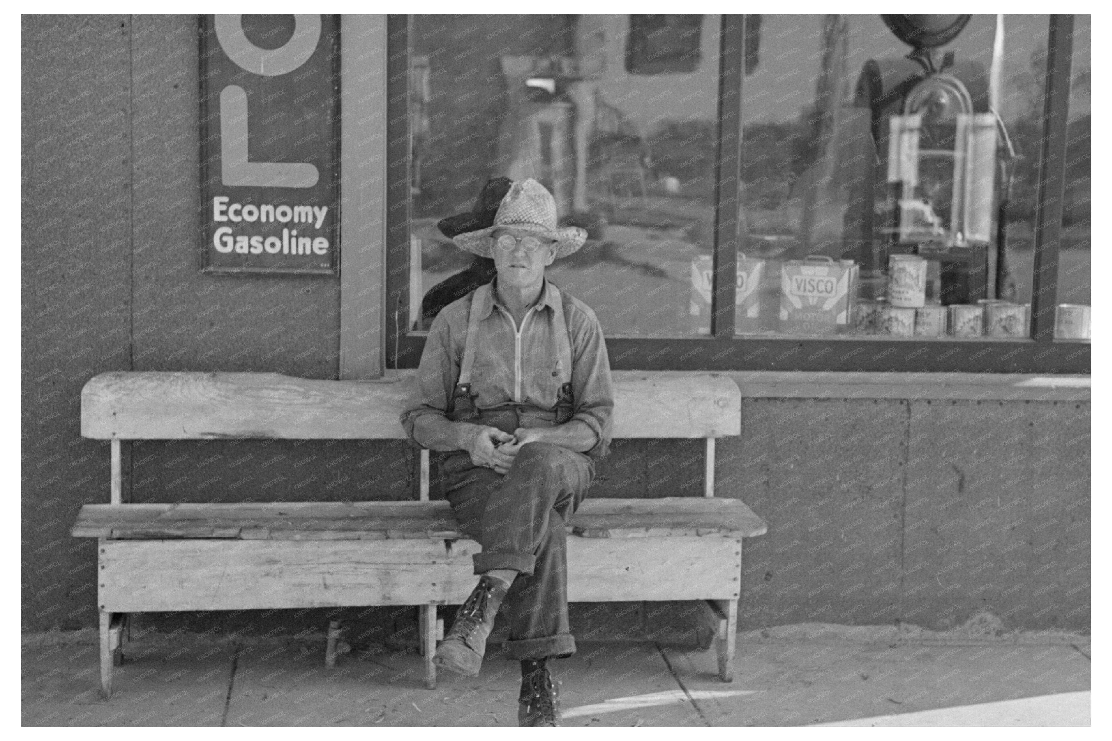 Man Seated in Front of Store Craigville Minnesota 1937