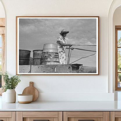 Mrs. Olie Thompson Driving Home with Water Barrels 1937