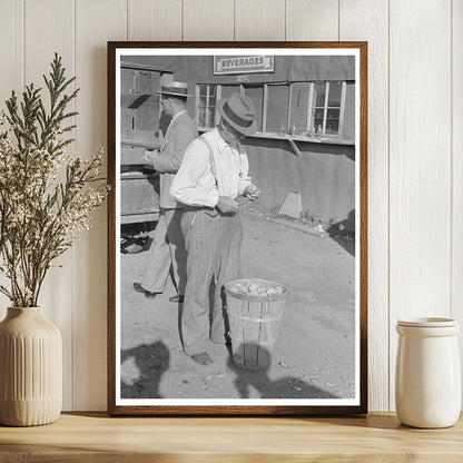 Farmer Eating Peach at Sikeston Auction May 1938