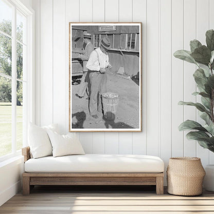 Farmer Eating Peach at Sikeston Auction May 1938