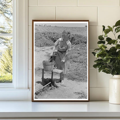 Daughter of Sharecropper Pumps Water May 1938 Missouri