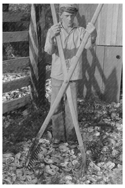 Young Boy with Oyster Rake in Olga Louisiana 1938