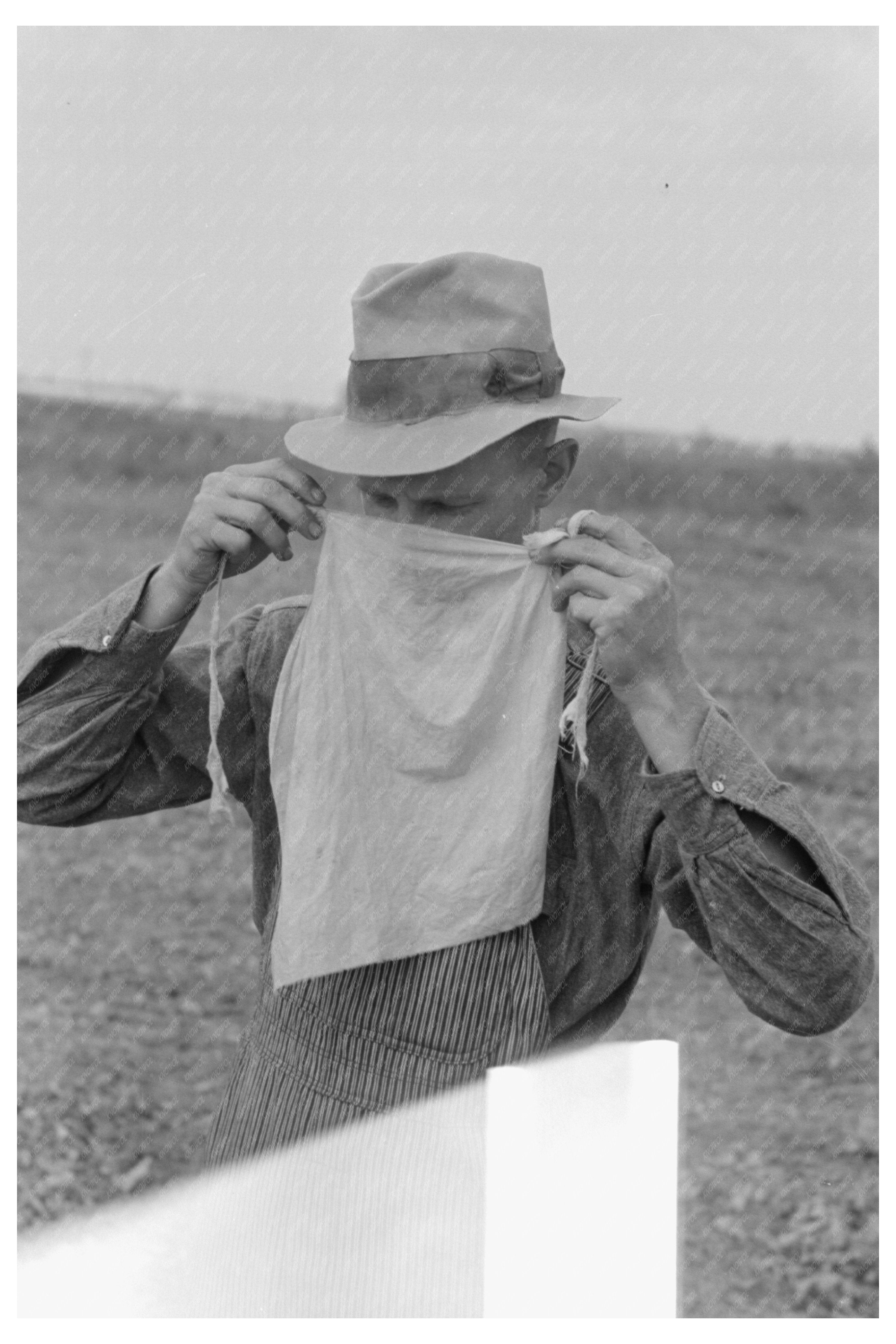 Farmer in Arkansas with Dust Mask during Haying 1938