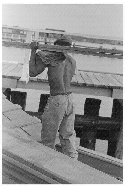 Stevedore Removing Lumber from El Rito in 1938