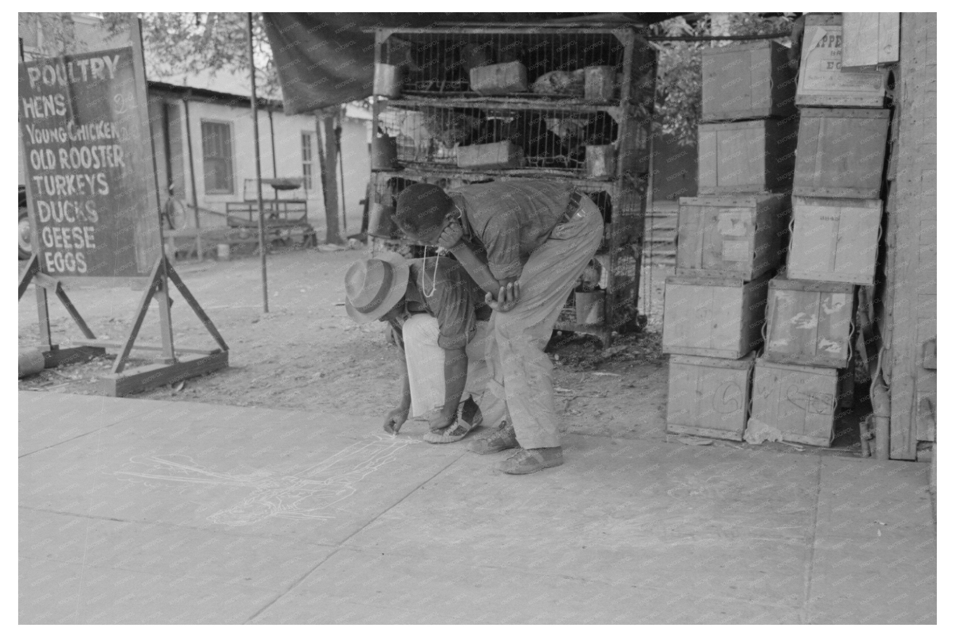 Young Boy Drawing on Sidewalk New Iberia Louisiana 1938